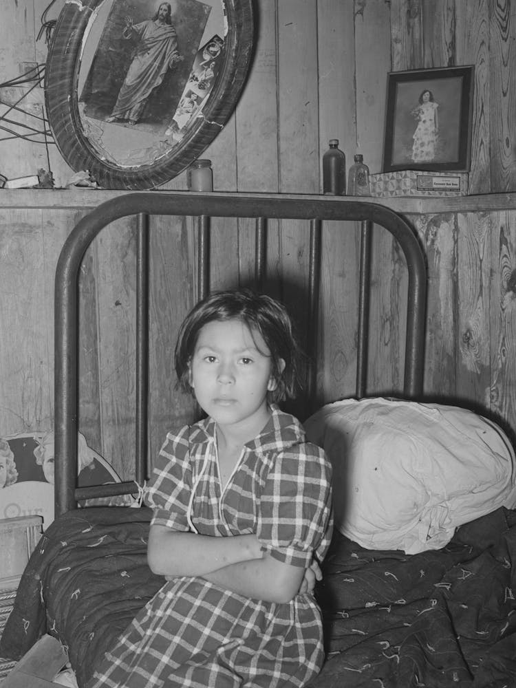 Mexican Girl Sitting On Bed, Crystal City, Texas By Russell Lee