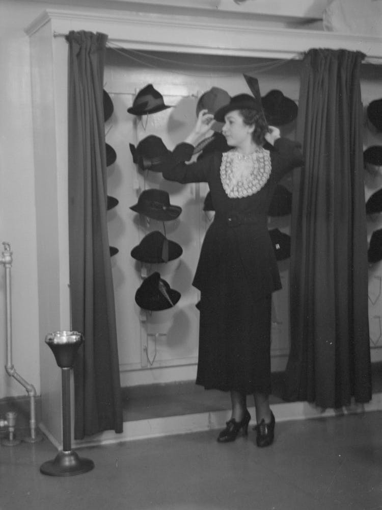 Untitled Photo, Possibly Related To Model Trying On Hat For A Buyer, New York City Showroom, Jersey