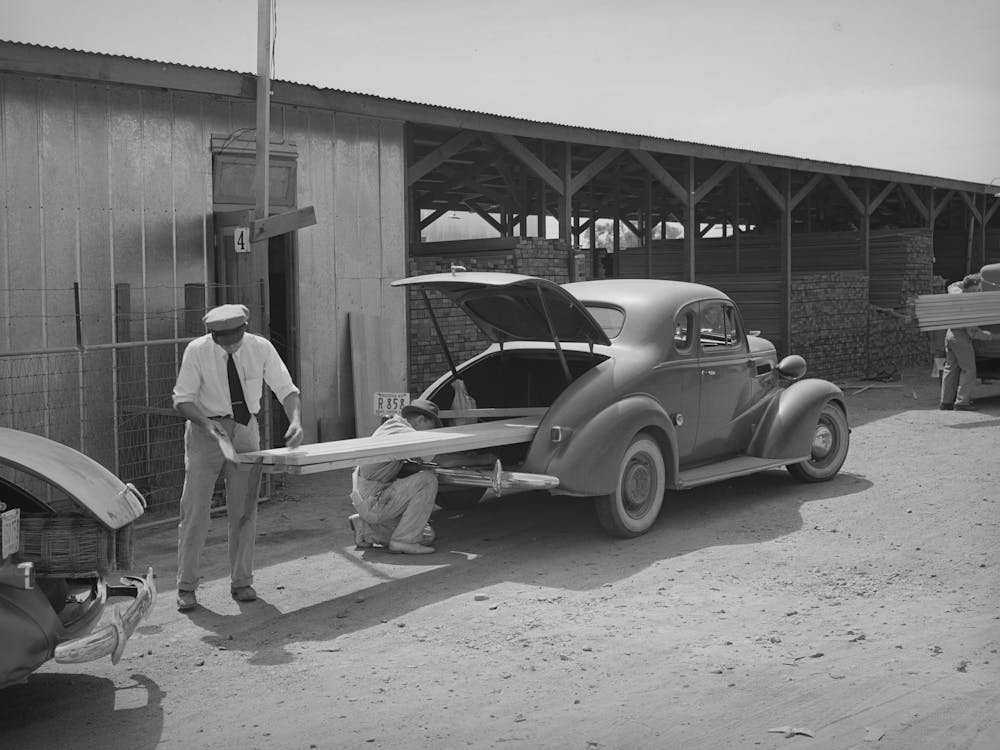 Member Of The United Producers And Consumers Cooperative Loading Lumber Into His Car, Phoenix, Arizona By Russ
