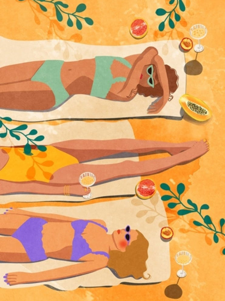 Women Laying On The Beach