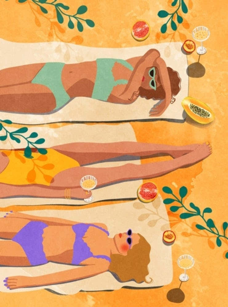 Women Laying On The Beach