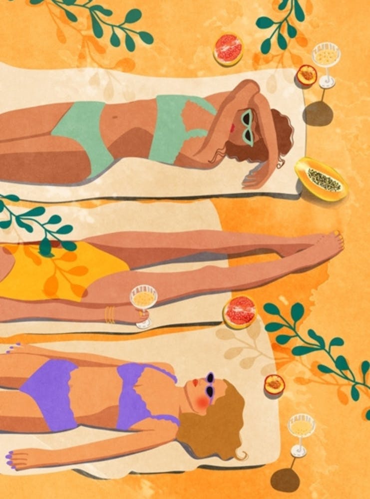 Women Laying On The Beach