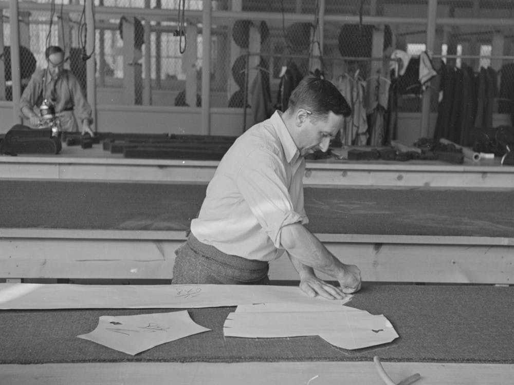 Louis Gushen, Chief Cutter In The Cooperative Garment Factory At Jersey Homesteads, Marks Out The Pattern Of