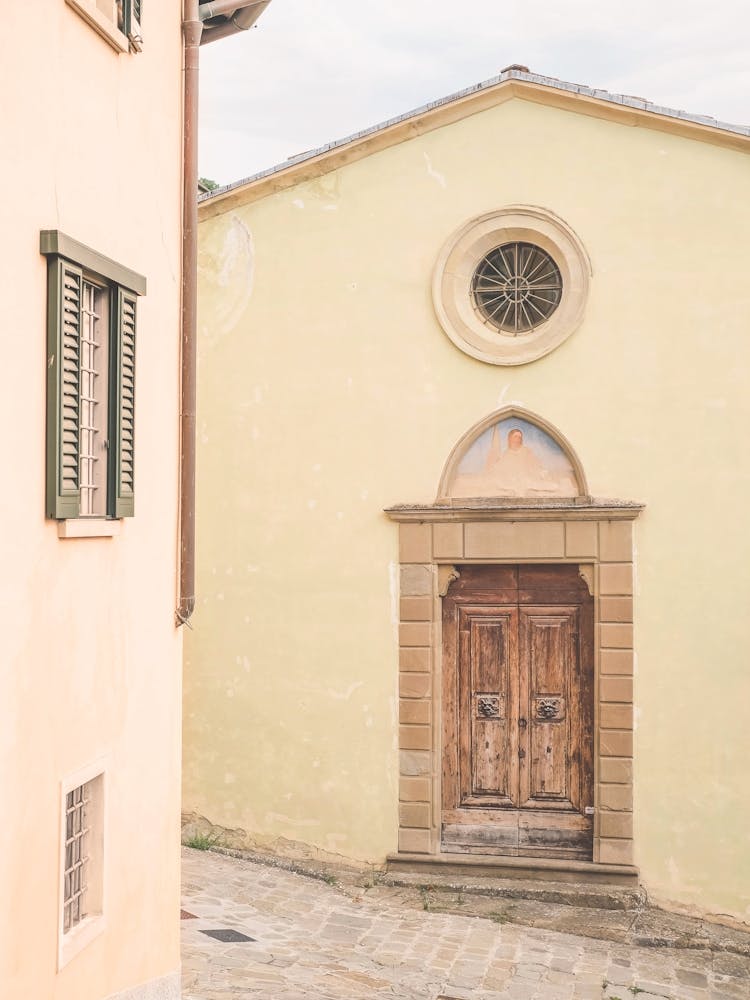 Florence, Italy I Vintage pastel door photography at church in the streets of the Tuscan countryside italian village of Fiesole to enjoy La Dolce Vita in Rome, Venice or Naples with a retro vintage aesthetic