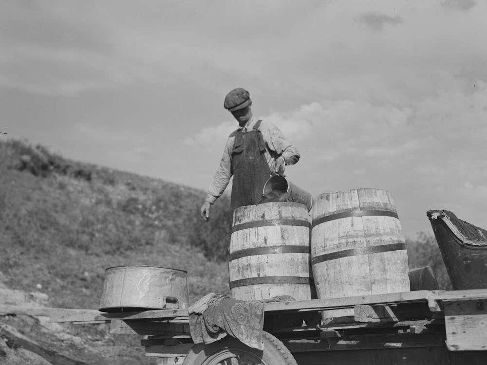 Herman Gerling Filling Barrels With Water From Spring, Both For Stock And Home Use, This Spring Also Supplies Other