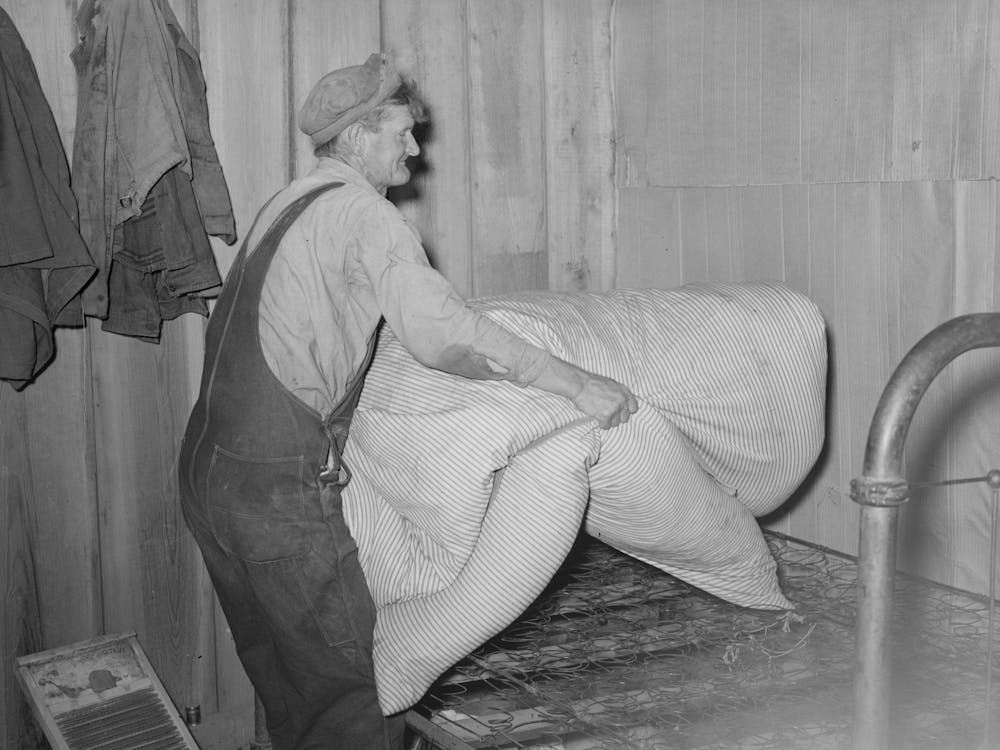 Elmer Thomas Removing The Mattress From Bed Which Will Be Packed Into Truck Enroute For California, Near Muskogee