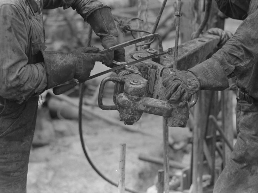 Detail Of Oil Workers Repairing Pipe Wrench; Notice Gloves, Oil Well, Kilgore, Texas By Russell Lee