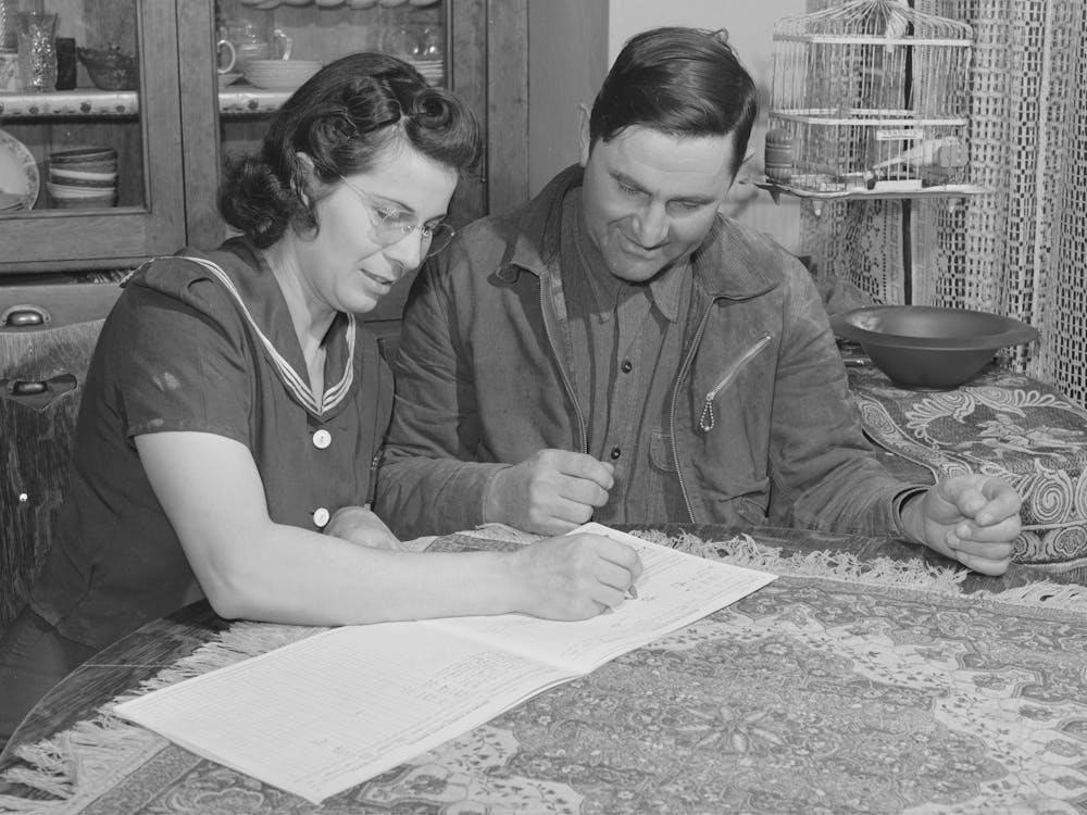 Mr, And Mrs,Lee Wagoner Work On Farm Records, They Live On The Black Canyon Project, Canyon County, Idaho By