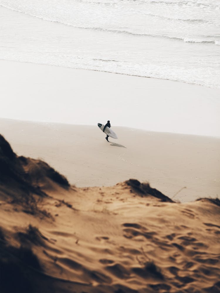 Surfer On Beach