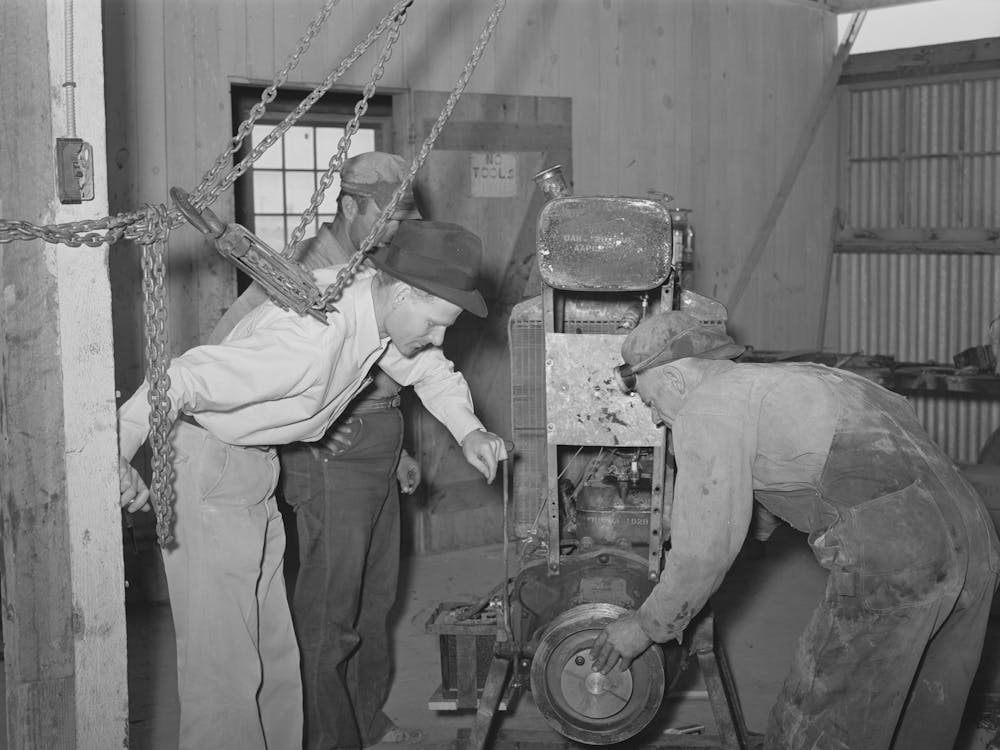 Members And Fsa (Farm Security Administration) Officials At Casa Grande Farms Making Repairs In Farm Machine