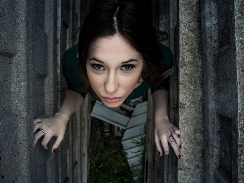 Beautiful Brunette Woman Posing Outdoor In Abandoned Industrial Place