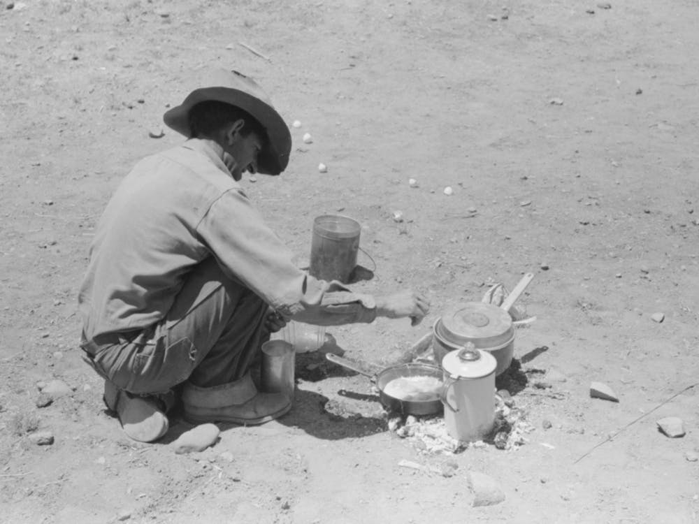 Faro Caudill Frying Eggs Over Camp Fire The Day He Was Moving His Dugout, Pie Town, New Mexico By Russell Lee