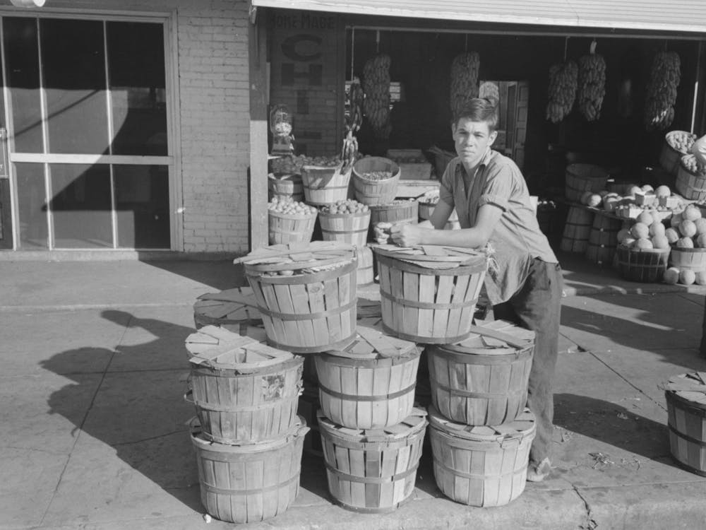 Grocery Boy Leaning On Basket Of Peaches, Muskogee, Oklahoma By Russell Lee