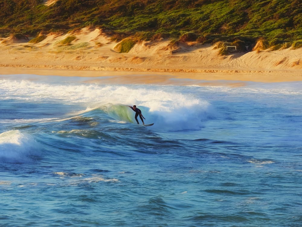Surfer Riding A Wave