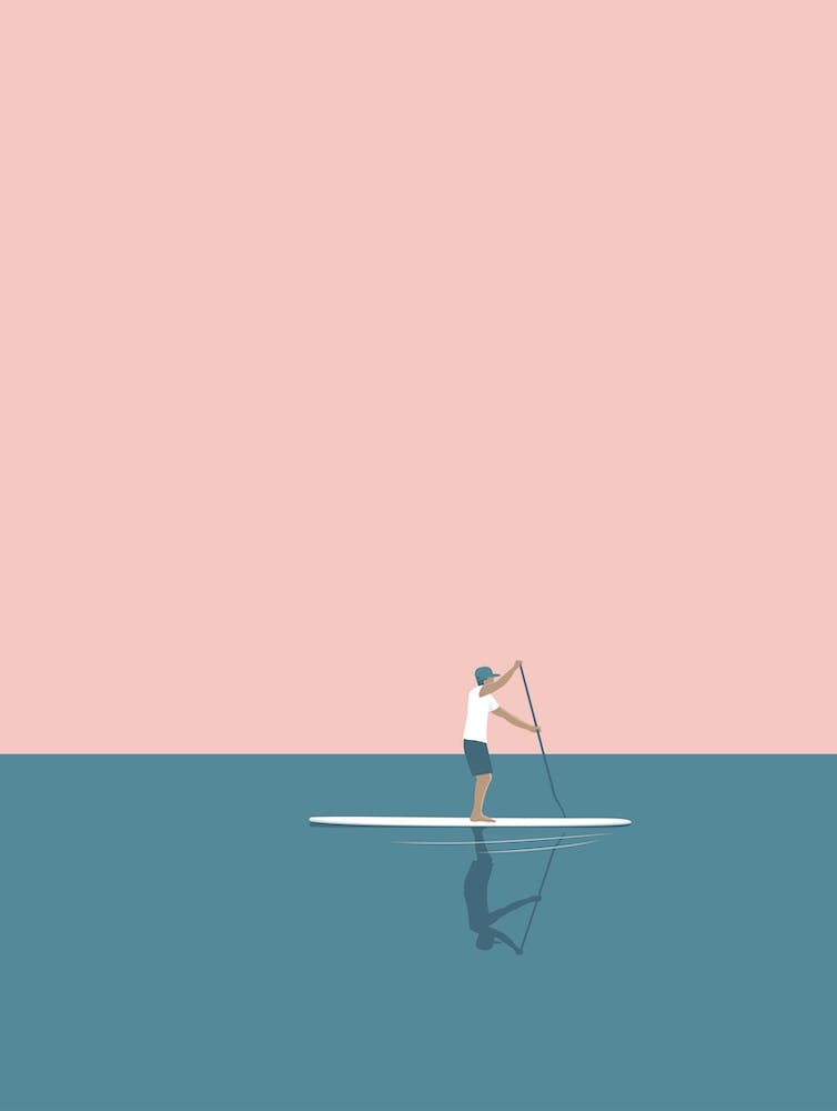 Minimal paddle boarding in pink
