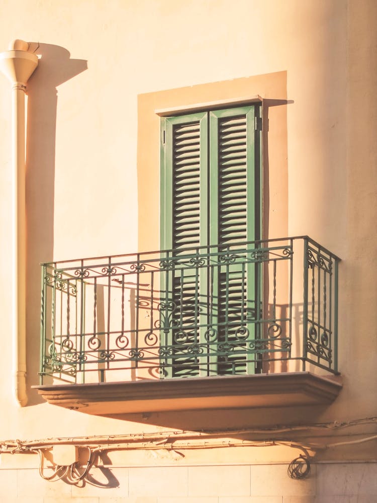 Puglia, Italy I Yellow and green italian window with roman architecture in the light of sunset with la dolce vita and a retro vintage pastel summer aesthetic geometric minimalist composition photography