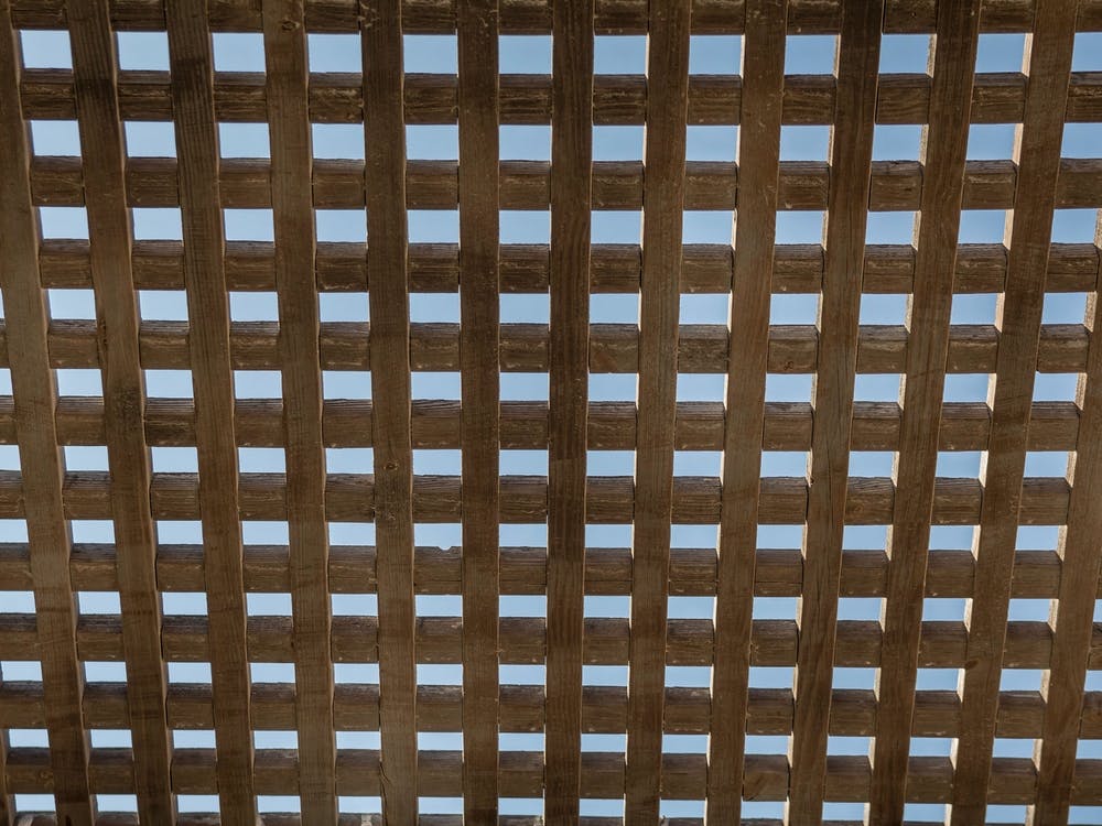 Wooden Square Grid In Color With Blue Sky
