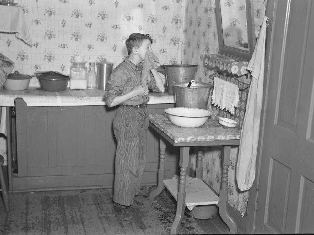 645 A M, Son Of Tip Estes Washing His Face After Doing His Early Morning Chores, Near Fowler, Indiana By Russe