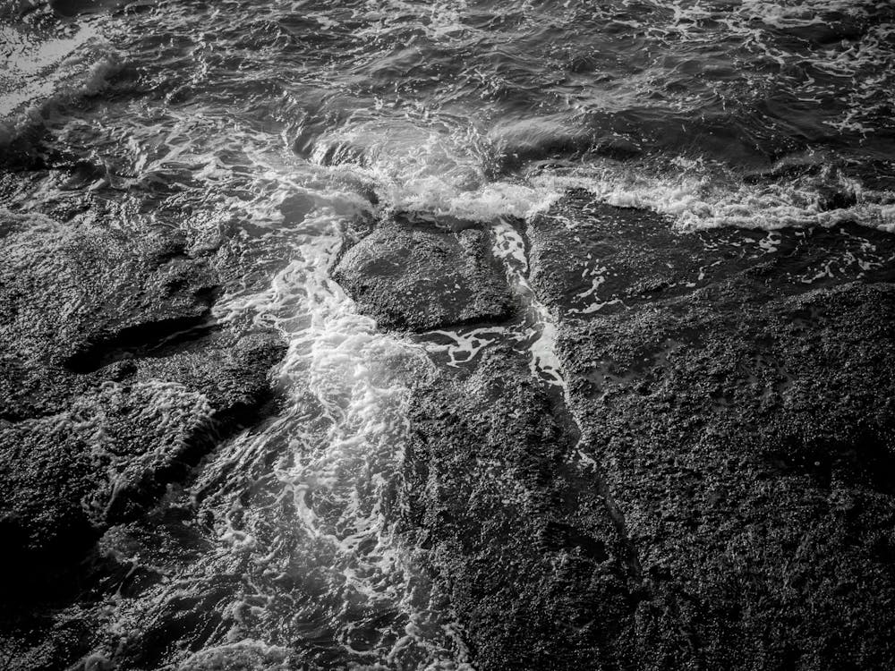 White Sea Foam And Black Rocks Surface 1