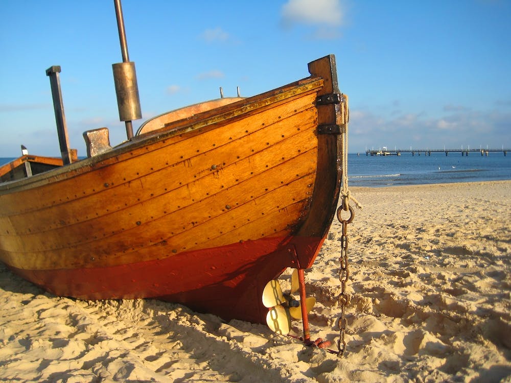 Old Wooden Boat On The Beach