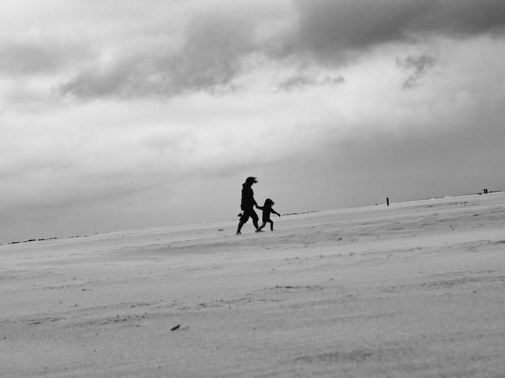 The Mother And Child Blowing On The Beach Texel Netherlands