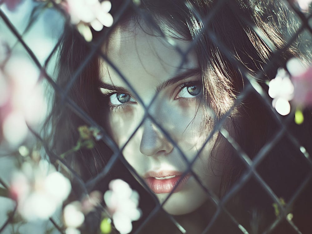 Girl Behind A Fence