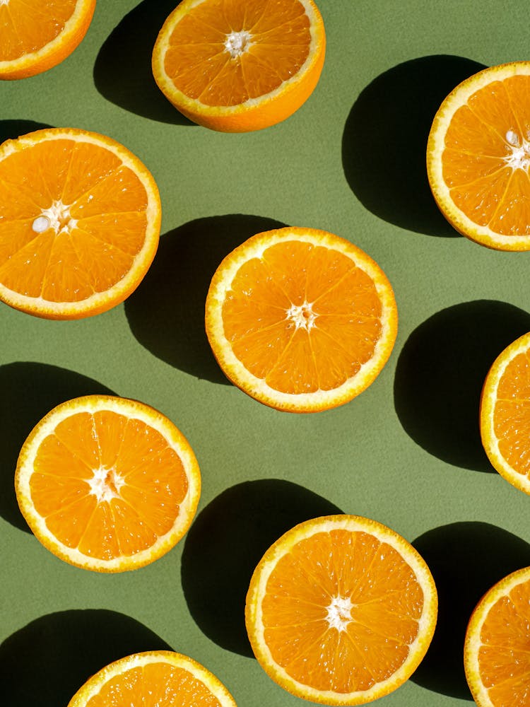 Orange Slices On Green Background