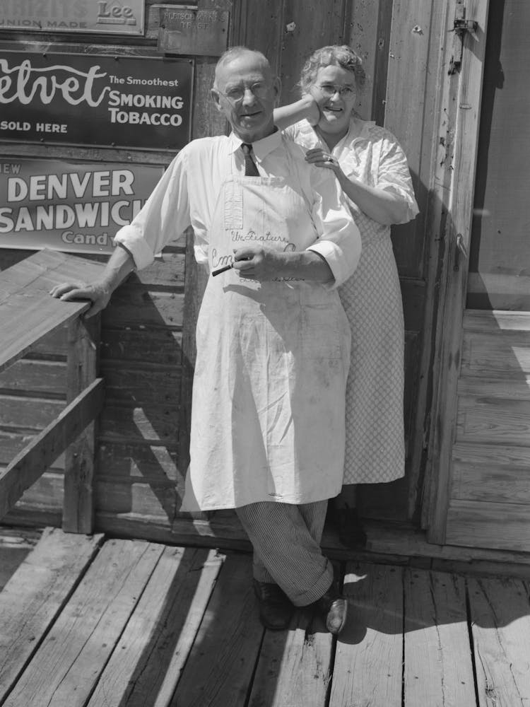 Storekeeper And His Wife In Front Of Their Store At Section 30, Bust Iron Mining Town Near Winton, Minnesota By Russel