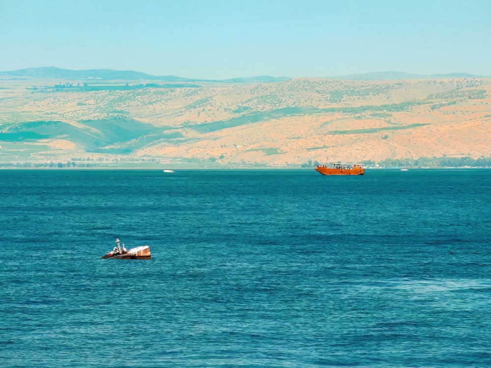 Brown Wooden Boat Sailing In Sea Of Galilee 1