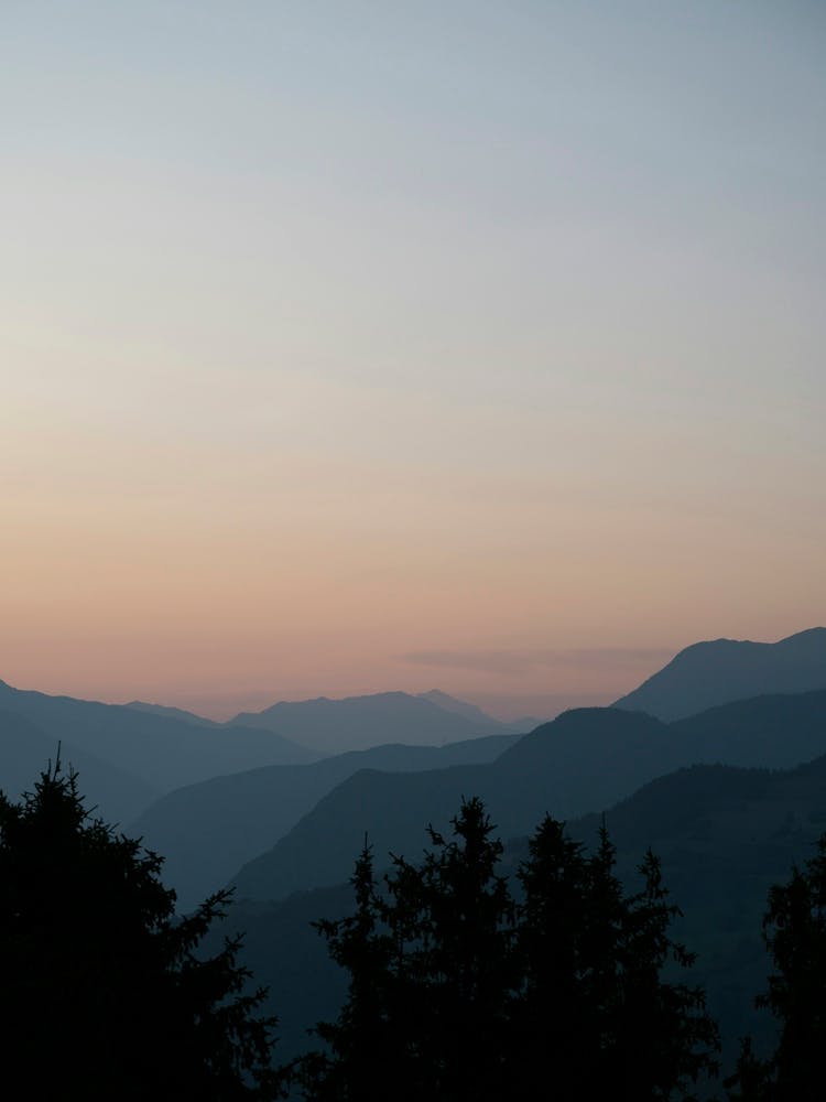 Pastel orange sunrise at Courchevel in France in the mountains - summer nature and travelphotography by Christa Stroo Photography