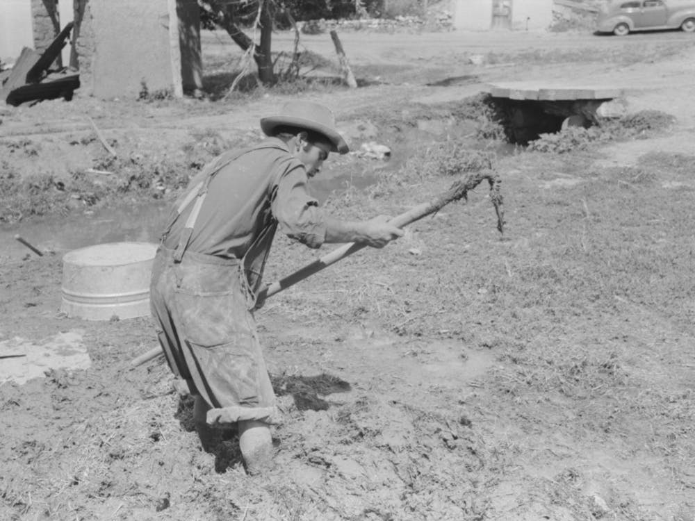 Spanish American Mixing Adobe Plaster, Chamisal, New Mexico By Russell Lee