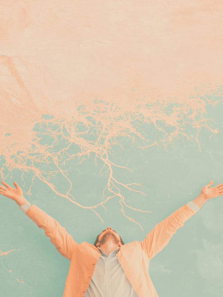 Man With Arms Outstretched