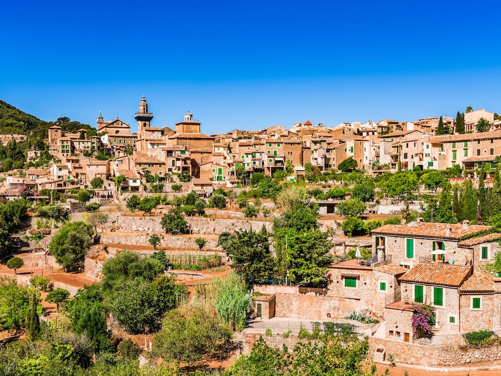 Idyllic view of Valldemossa, mediterranean Mallorca village at Spain. Village landscape of Valldemossa on Majorca, Spain Balearic Islands. A serene village landscape of Valldemossa, nestled in the scenic Balearic Islands of Spain.