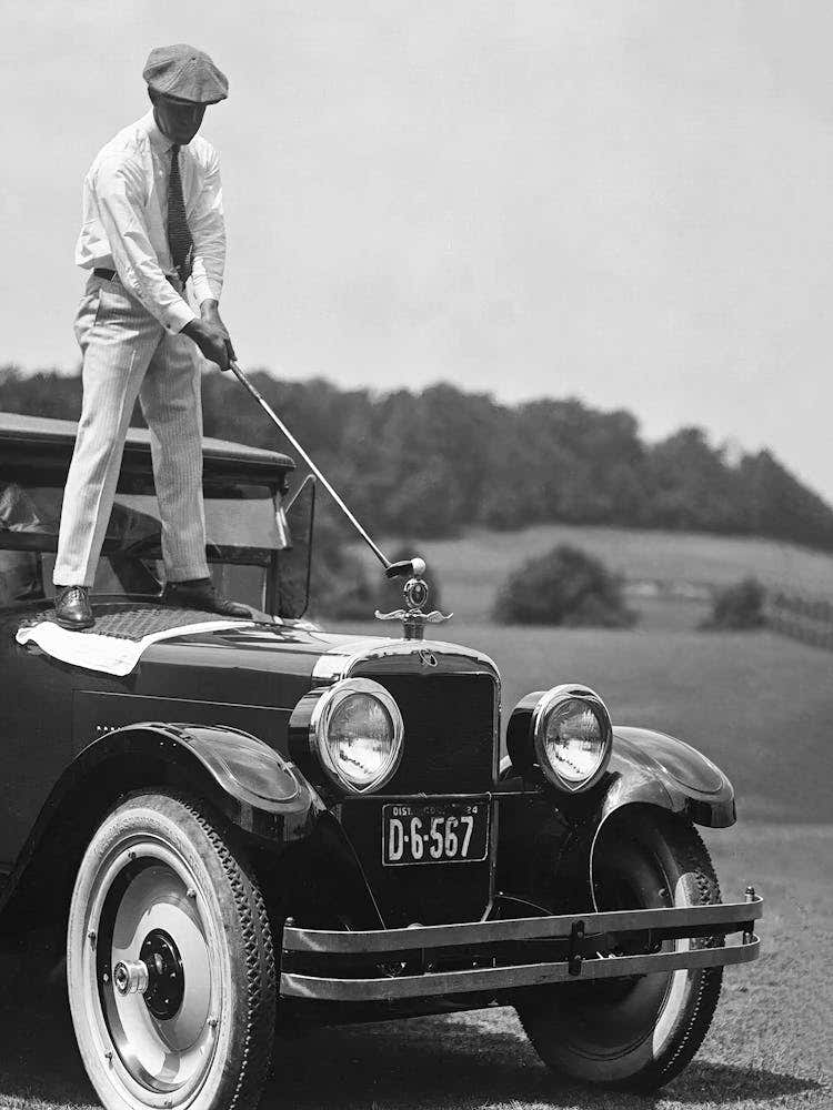 Man Playing Golf On Top Of Car, Funny Golf Art, Vintage Black and White Old Photo