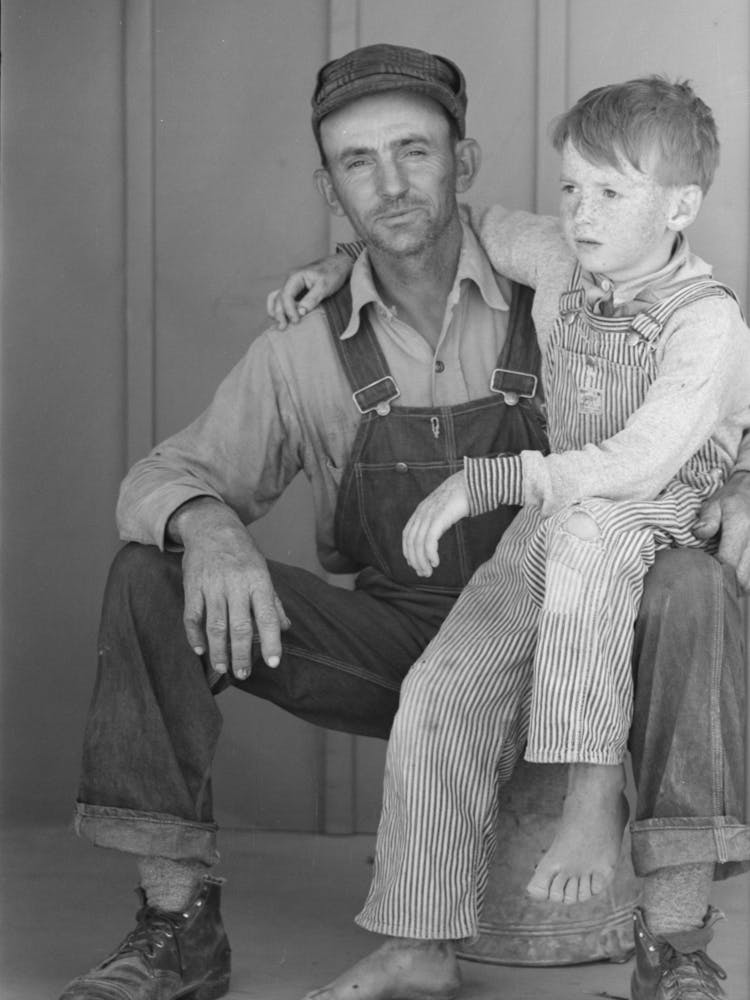Migratory Laborer And His Son Living At The Agua Fria Migratory Labor Camp, Arizona By Russell Lee