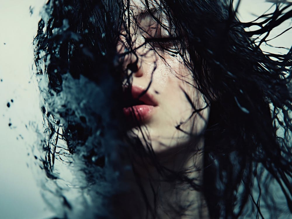 Portrait Of A Woman With Hair In Water