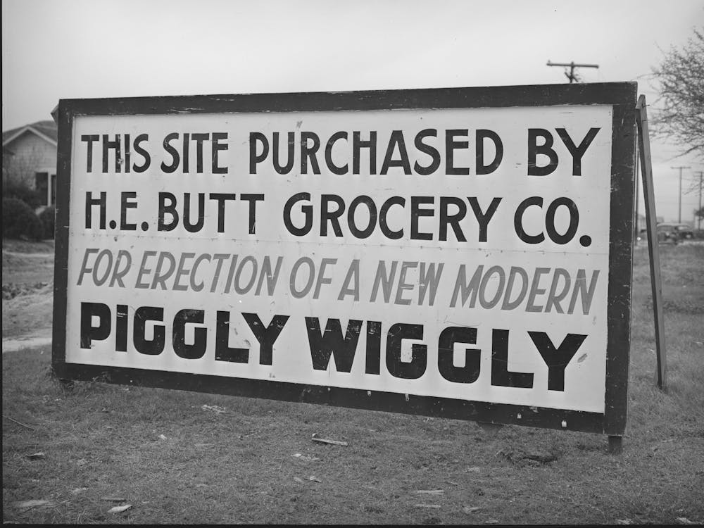 Sign Announcing Intending Construction Of New Grocery Store In Community Springing Up About Five Miles From The