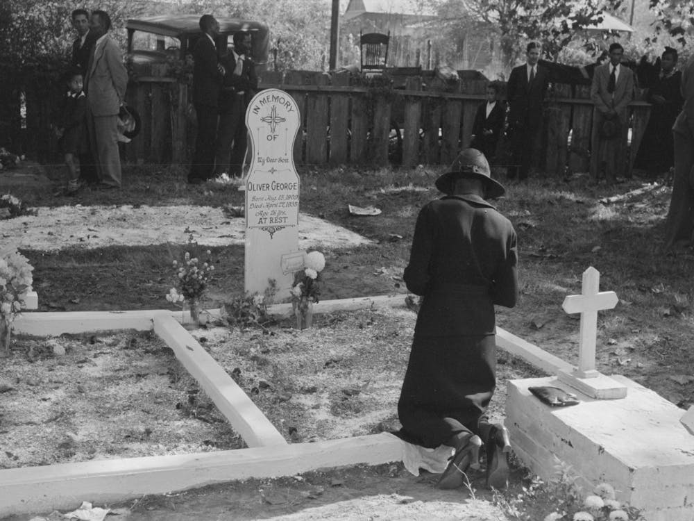 Women Praying At Grave Of Son In Cemetery At New Roads, Louisiana On All Saints Day By Russell Lee