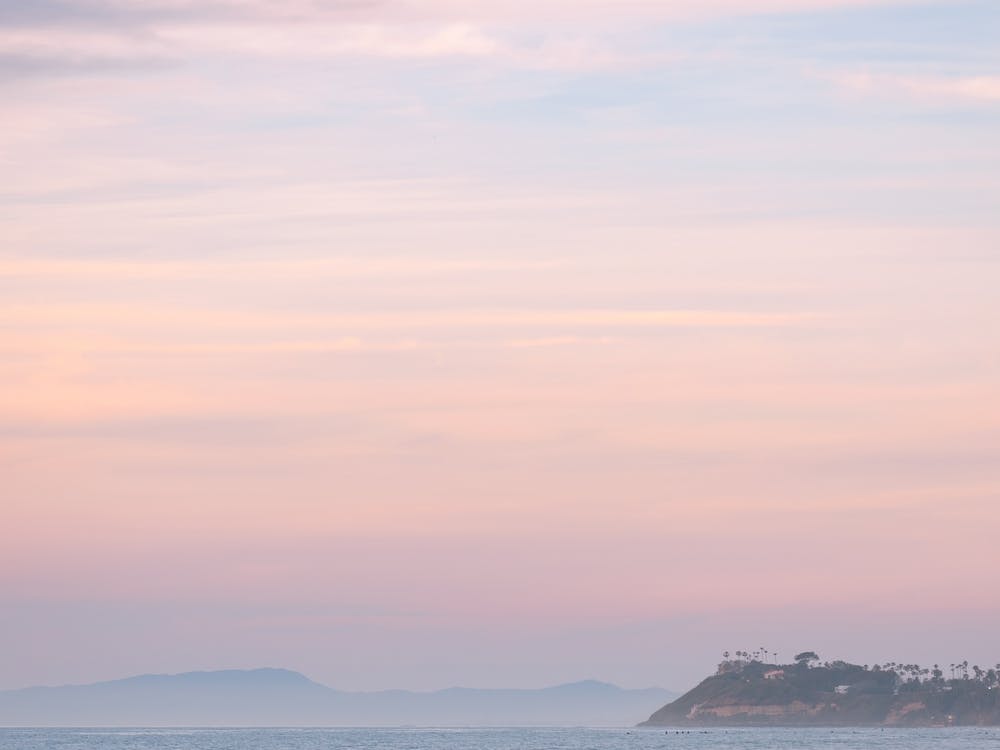 Pastel Sunset Over The Coastline