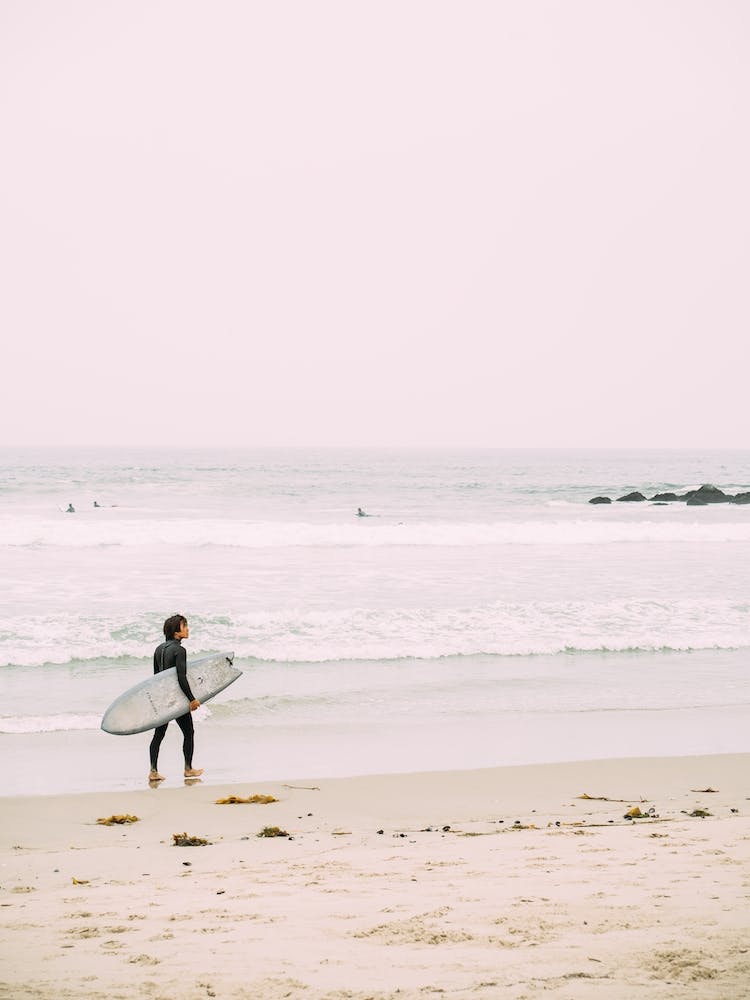 Surfer On The Beach