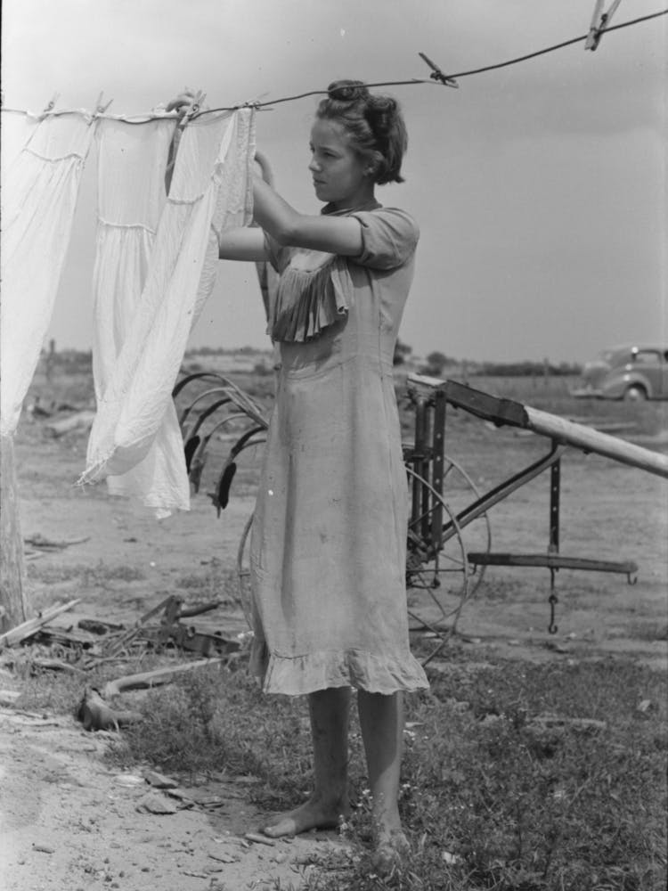 Daughter Of Tenant Farmer Hanging Up Clothes Near Warner, Oklahoma By Russell Lee