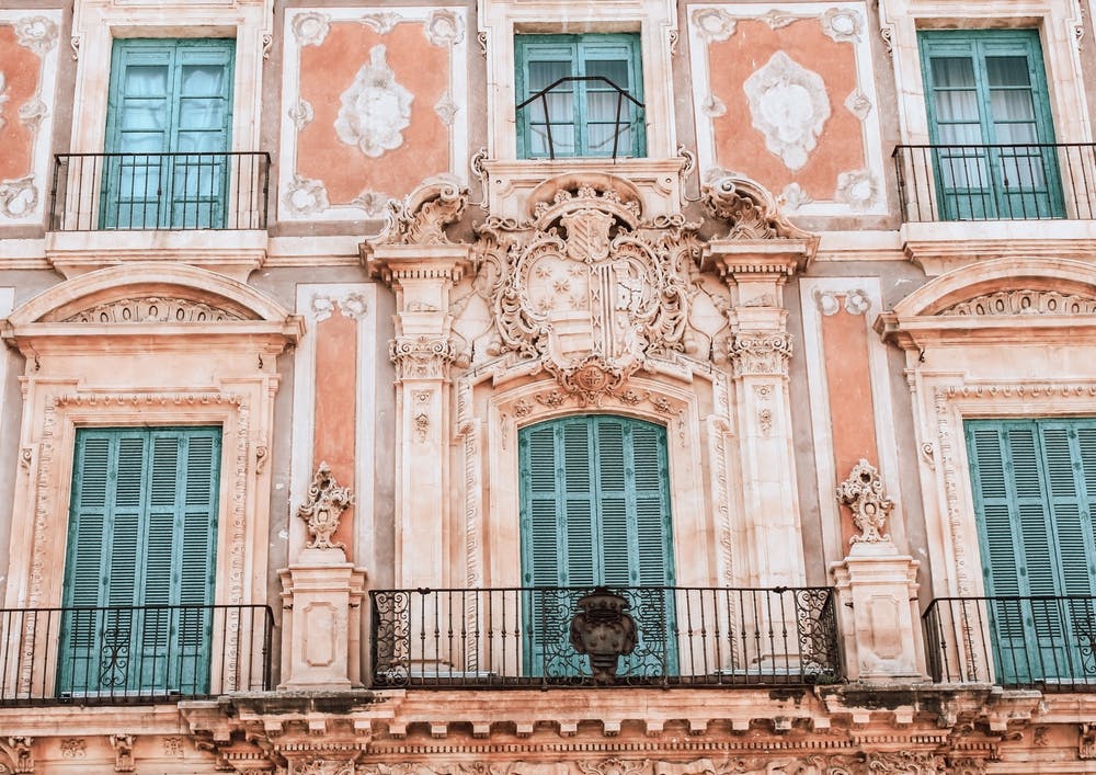 The Pink Building And The Blue Shutters Spain Travel