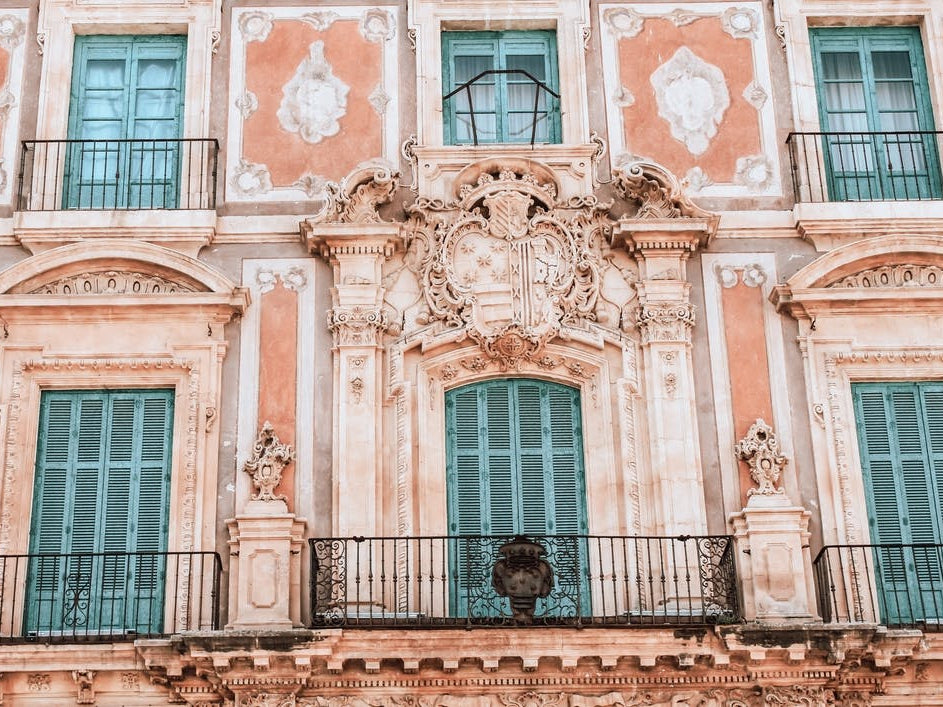 The Pink Building And The Blue Shutters Spain Travel
