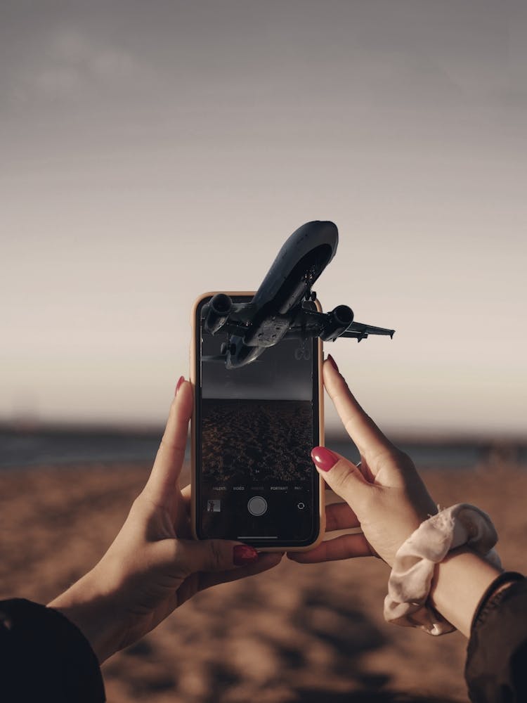 Portrait Of A Woman Holding A Smartphone Pop Up Plane