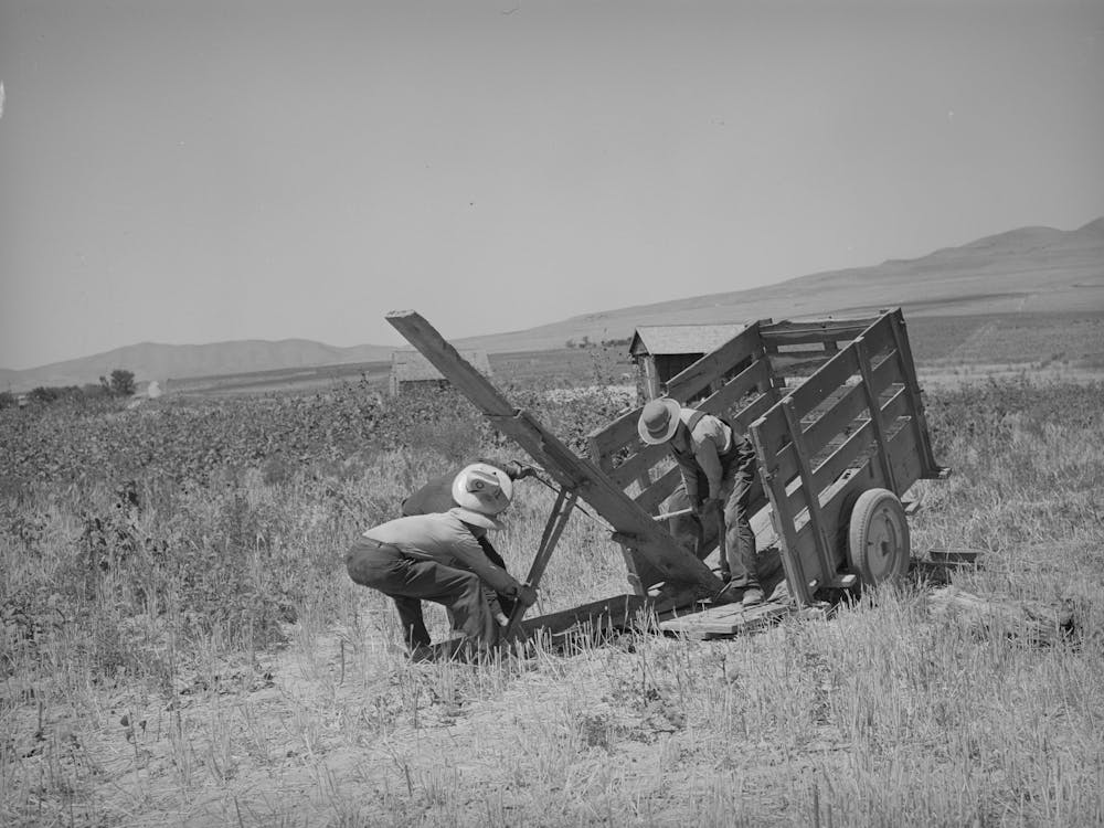 Unloading Fsa (Farm Security Administration) Cooperative Ditcher From Trailer, Box Elder County, Utah By