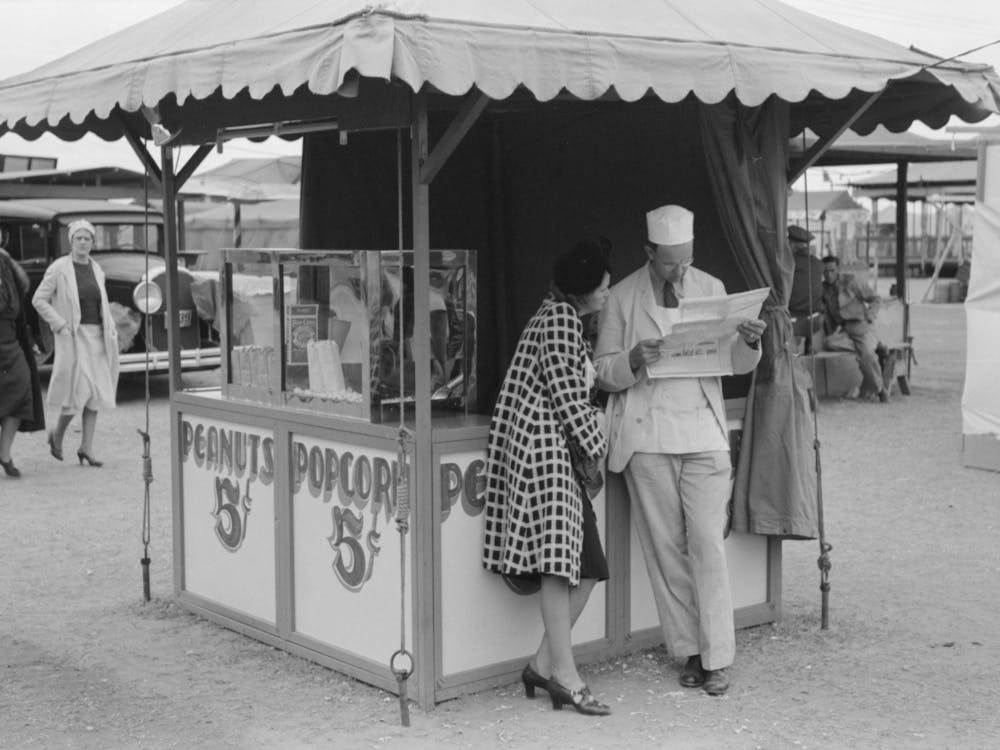 Popcorn Man And His Wife Studying The Map, County Fair, Gonzales, Texas By Russell Lee