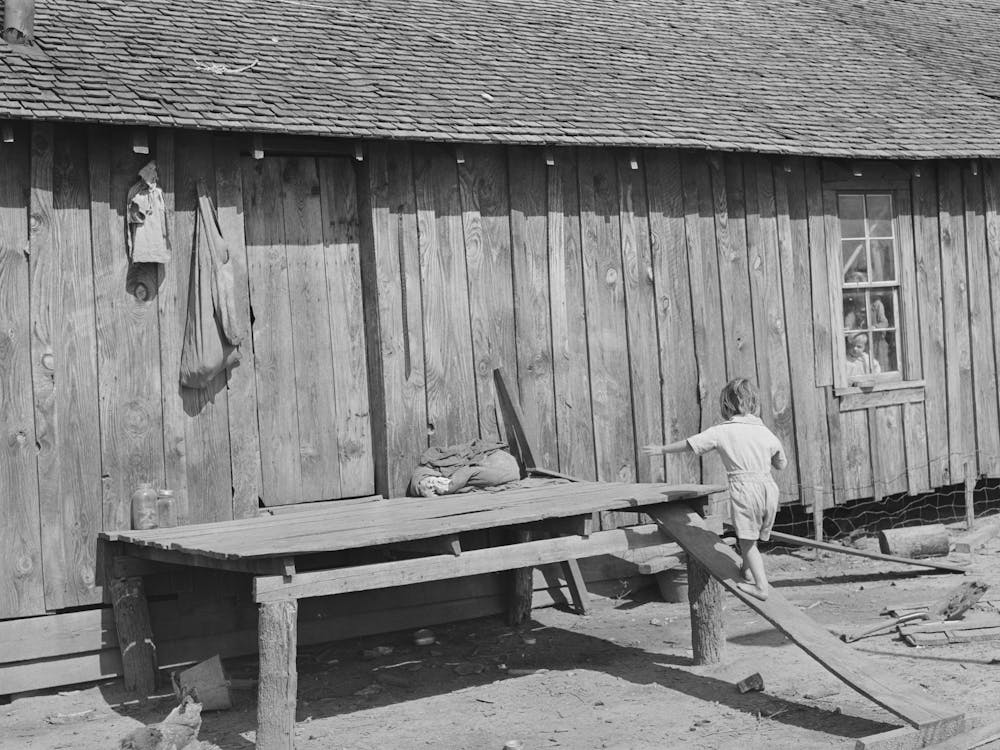 Child Walking Up Improvised Stairway On Back Of His Home Near Jefferson, Texas, Housing Conditions Are Bad Throughout