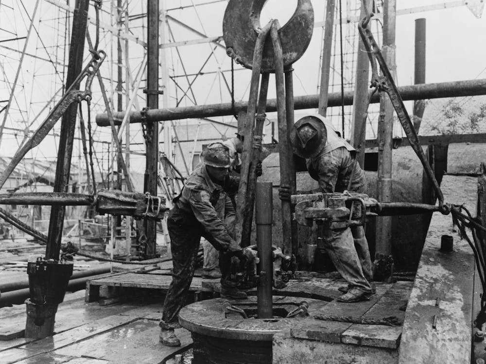 Pulling Clamp Of Elevator In Place To Being Up Section Of Drill Pipe, Oil Well, Kilgore, Texas By Russell Lee