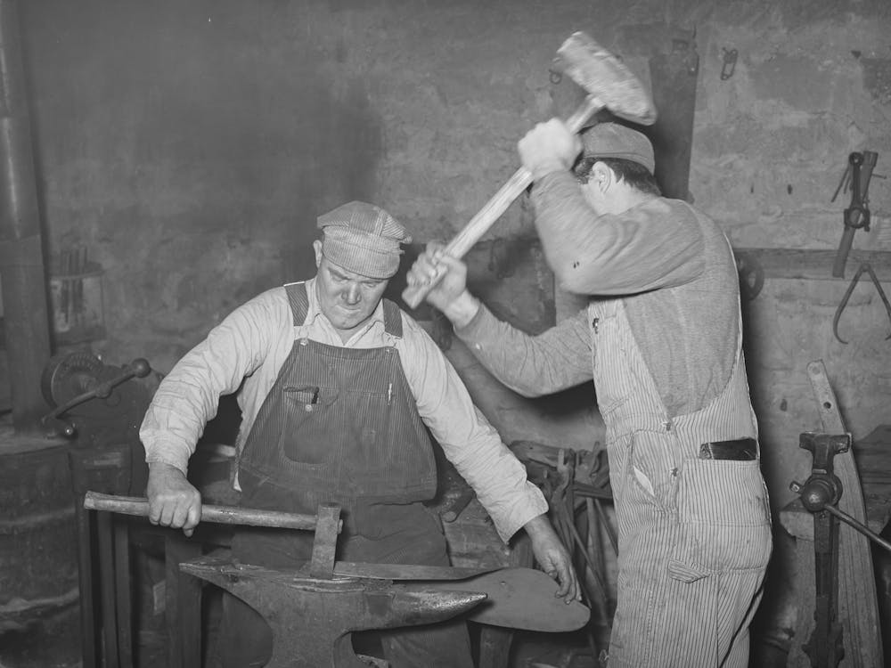 Blacksmith And Helper Pounding Out Plow Point,Depew, Oklahoma By Russell Lee 1