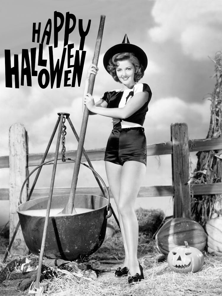 Young Witch Is Preparing A Halloween Brew In A Bowl